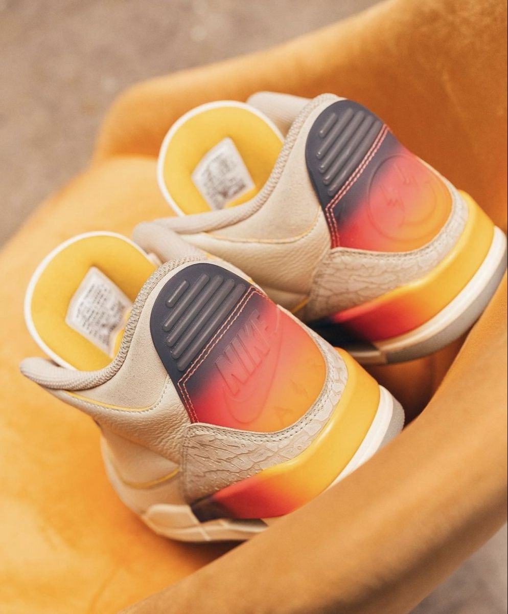 Close-up van Air Jordan 3 Retro SP J Balvin Medellín Sunset FN0344-901 met zichtbare Air unit, elephant print en kleurrijke gradient midsole