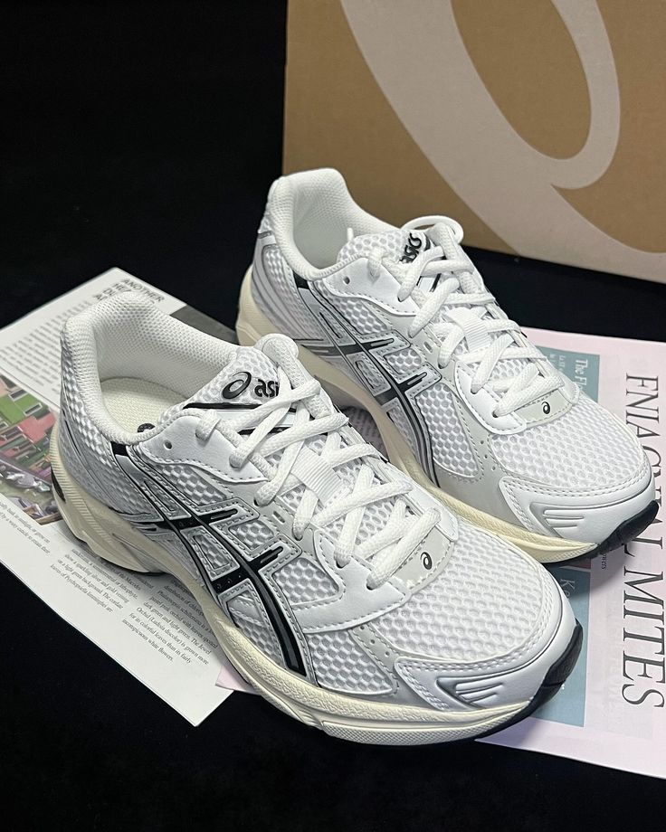 ASICS GEL-1130 White Cloud Grey 1201A256-118 sneakers beside box highlighting reflective details, GEL sole and retro design.