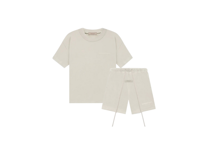 Fear of God Essentials Wheat Summer Set with short sleeve T-shirt and shorts displayed flat on neutral beige background.