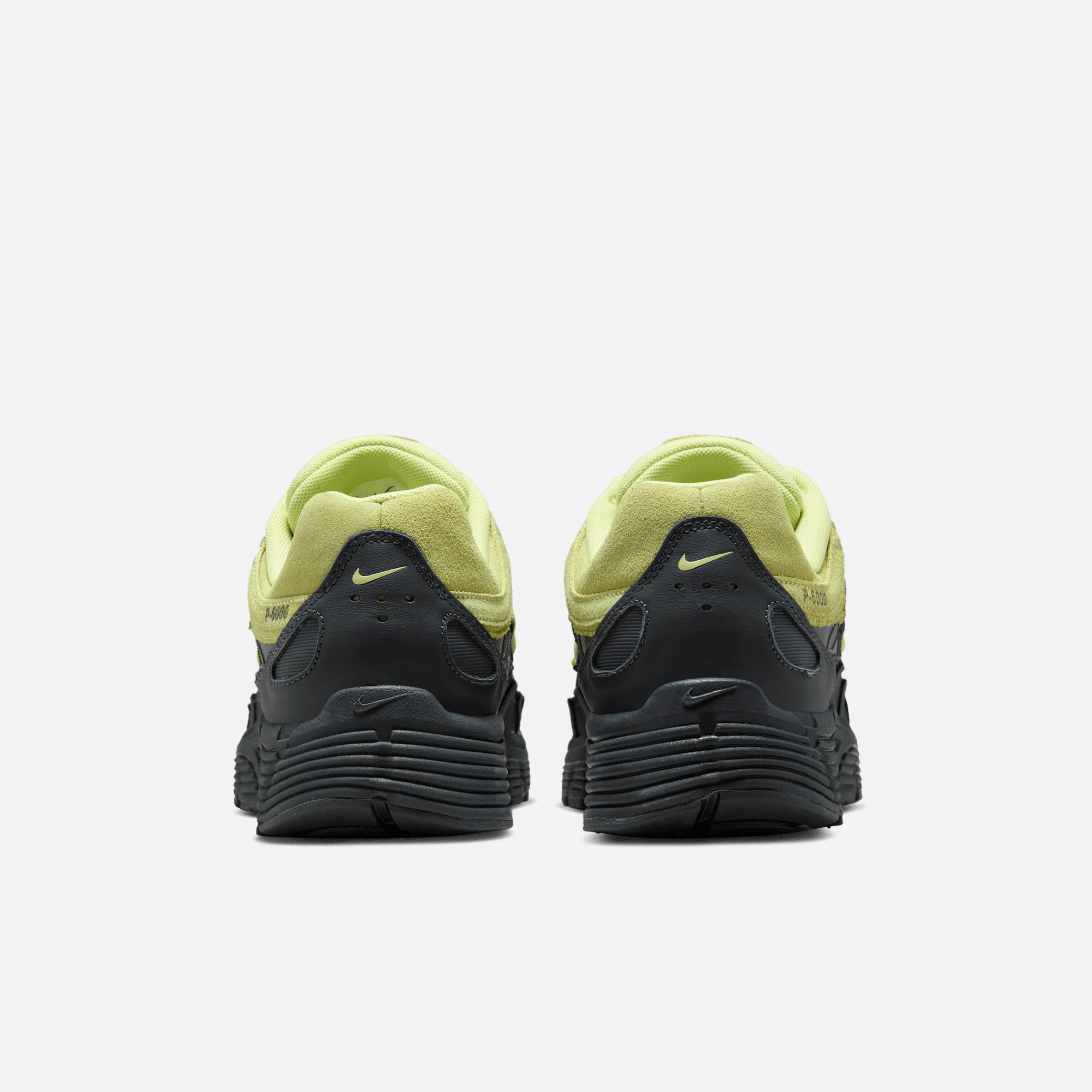 Nike P-6000 Premium Limelight on foot – gedragen in een technische streetwear fit met donkere tinten en neon accenten via Snrkickz