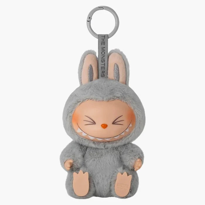 Pop Mart Labubu Have A Seat Hehe – zittende Labubu met roze pluche outfit en speelse blik, sealed collectible van Pop Mart