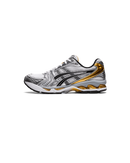 Zijkant van de ASICS Gel Kayano 14 White Pure Gold met wit mesh, gouden accenten en GEL-demping – sportief retro design in luxe kleurstelling

