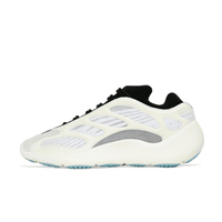 Zijaanzicht van de Adidas Yeezy 700 V3 Azael met glow-in-the-dark cage, crèmekleurige zool en witte mesh basis tegen witte achtergrond