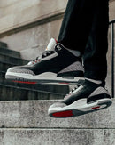 Air Jordan 3 Retro Black Cement 854262-001 on-feet gecombineerd met tapered denim voor een klassieke streetwear look

