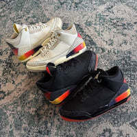 Air Jordan 3 Retro J Balvin Rio FZ4833-001 in hand met felle oranje, roze en paarse midsole-accenten en geborduurde J Balvin smiley

