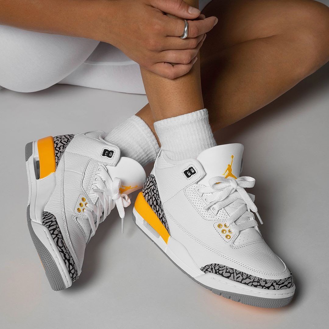 Air Jordan 3 Retro Laser Orange CK9246-108 on-feet gestyled met lichte jeans voor een frisse zomerse streetwear look

