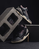 Air Jordan 3 Retro Off Noir CT8532-001 on-feet gecombineerd met zwarte denim jeans voor een strakke streetwear look

