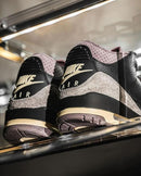 Close-up van Air Jordan 3 Retro OG SP A Ma Maniére While You Were Sleeping FZ4811-001 met geperforeerde panelen, premium materialen en AMM-logo

