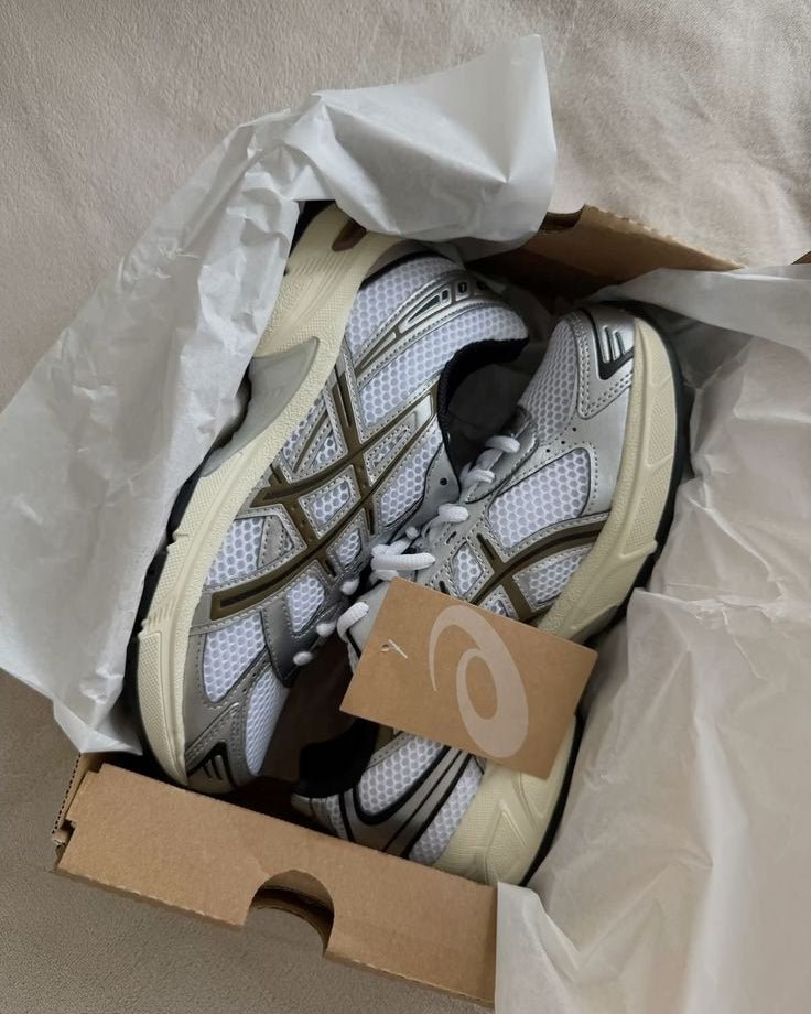ASICS GEL-1130 White Clay Canyon in box showing detailed stitching, silver overlays and clean neutral colorway.