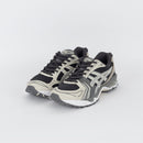 ASICS GEL-Kayano 14 dual-pair bovenaanzicht met ademend mesh en reflecterende overlays zichtbaar op hiel en tong