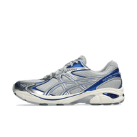 ASICS GT-2160 Piedmont Grey Deep Marine zijaanzicht met grijze mesh basis, donkerblauwe Deep Marine overlays en metallic accenten

