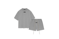 Fear of God Essentials Dark Heather Oatmeal Short Set FW23 with short sleeve T-shirt and shorts displayed flat on clean studio background.