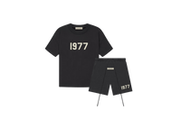 Fear of God Essentials 1977 Iron Summer Set with short sleeve T-shirt and shorts displayed flat on neutral studio background.
