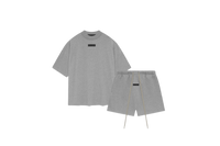 Fear of God Essentials Dark Heather Oatmeal Short Set FW23 with short sleeve T-shirt and shorts displayed flat on clean studio background.