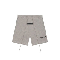 Fear of God Essentials Dark Oatmeal shorts flat lay highlighting minimalist branding, elastic waistband and signature drawcords.