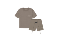 Fear of God Essentials Desert Taupe Summer Set with short sleeve T-shirt and shorts displayed flat on clean studio background.