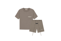 Fear of God Essentials Desert Taupe Summer Set with short sleeve T-shirt and shorts displayed flat on clean studio background.