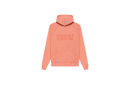 Fear of God Essentials FW22 Coral Hoodie flat lay showing vibrant coral tone, soft cotton fleece and minimalist Essentials chest logo.
