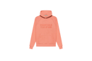 Fear of God Essentials FW22 Coral Hoodie flat lay showing vibrant coral tone, soft cotton fleece and minimalist Essentials chest logo.