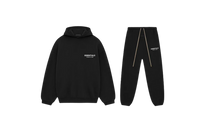 Fear of God Essentials FW24 Black White full set with hoodie and sweatpants displayed flat on neutral studio background.