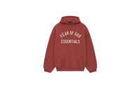 Fear of God Essentials FW24 Crimson Hoodie flat lay showing bold red tone, soft cotton fleece and subtle Essentials chest logo.