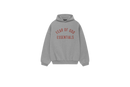 Fear of God Essentials FW24 Dark Heather Hoodie flat lay showing dark grey tone, soft fleece texture and subtle Essentials chest logo.