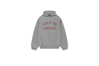 Fear of God Essentials FW24 Dark Heather Hoodie flat lay showing dark grey tone, soft fleece texture and subtle Essentials chest logo.