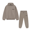 Fear of God Essentials FW24 Heather Taupe hoodie and sweatpants set flat lay highlighting matching tone, oversized fit and clean design.