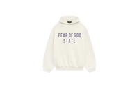 Fear of God Essentials FW24 Shell Hoodie flat lay showing light beige tone, soft cotton fleece and subtle Essentials chest logo.