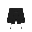 Fear of God Essentials Limo Black shorts flat lay highlighting relaxed fit, tonal logo and minimalist drawstring design.