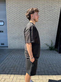 fear-of-god-essentials-limo-black-summer-setsnrkickz-model on body 2