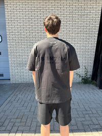 fear-of-god-essentials-limo-black-summer-setsnrkickz-model on body back2
