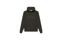 Fear of God Essentials Off Black Hoodie flat lay showing washed black tone, soft cotton fabric and subtle Essentials chest logo.