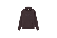 Model wearing Fear of God Essentials Plum Hoodie highlighting oversized relaxed fit, rich purple tone and signature streetwear design.