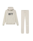 Fear of God Essentials Wheat 1977 full set with hoodie and sweatpants shown flat on clean light background.