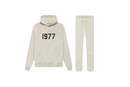 Fear of God Essentials Wheat 1977 full set with hoodie and sweatpants shown flat on clean light background.