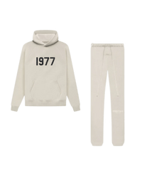 Fear of God Essentials Wheat 1977 full set with hoodie and sweatpants shown flat on clean light background.