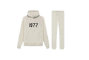 Fear of God Essentials Wheat 1977 full set with hoodie and sweatpants shown flat on clean light background.