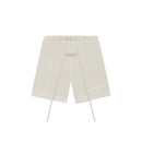 Fear of God Essentials Wheat shorts flat lay featuring minimalist design, elastic waistband and tonal Essentials logo.
