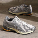 New Balance 1906 Moonbeam Raincloud U1906RDD lifestyle shot highlighting metallic finish, vintage sole and comfort-driven design.