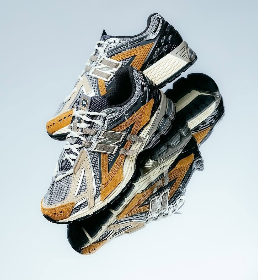 Close-up van het bovenwerk van de 1906A Great Plains met ademend mesh en zachte suède overlays. De neutrale lagen creëren diepte en versterken het premium karakter van dit model.

