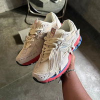 in-hand-new-balance-1906a-sea-salt-astro-dust on feet