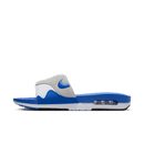 Zijaanzicht van de OG Royal Air Max Slide met transparante Air-unit, witte upper en kobaltblauwe zool op clean white backdrop