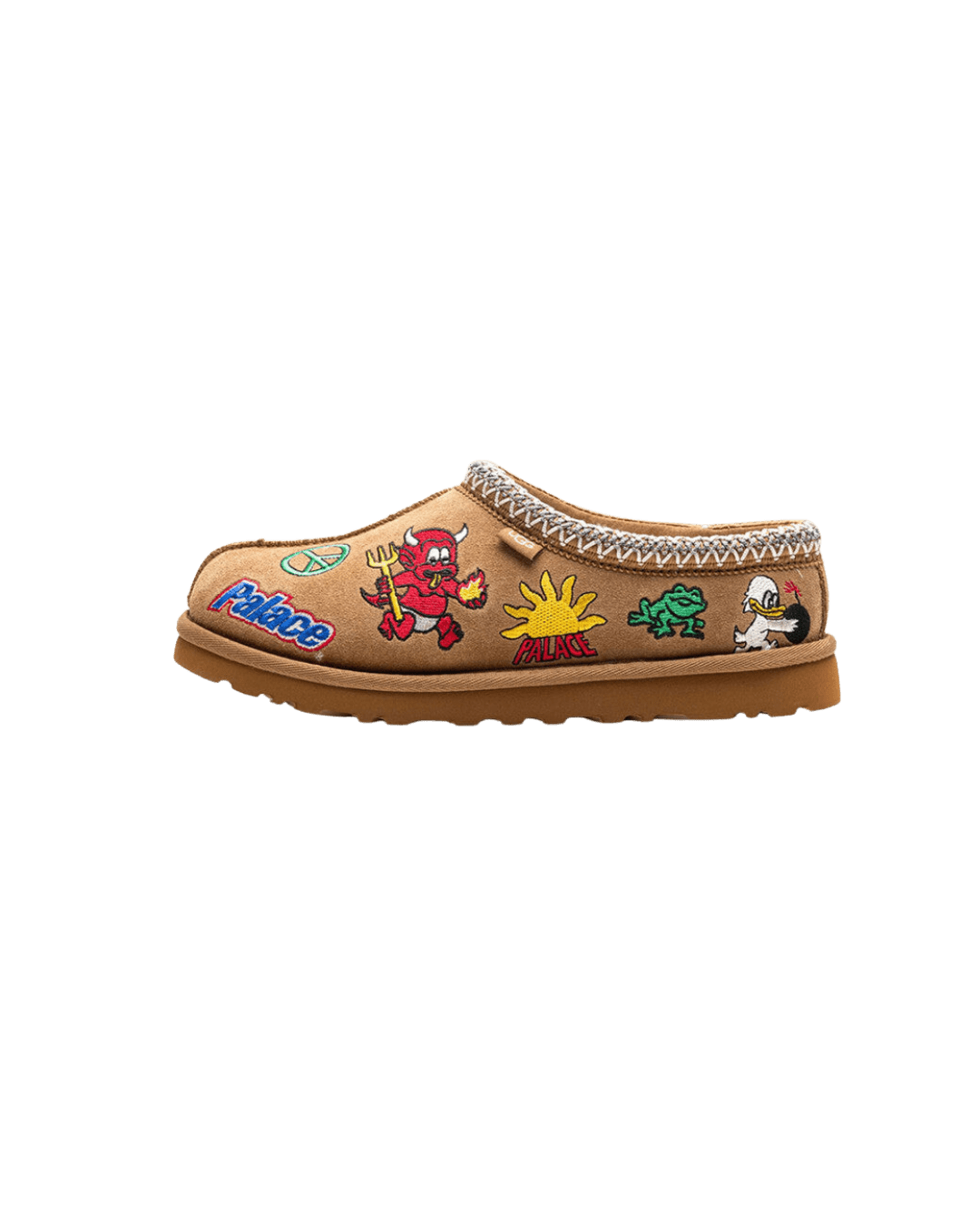 Zijaanzicht van de UGG Tasman Palace in Chestnut met grove suède afwerking, contrasterende stiknaden en zachte shearling voering voor optimaal comfort